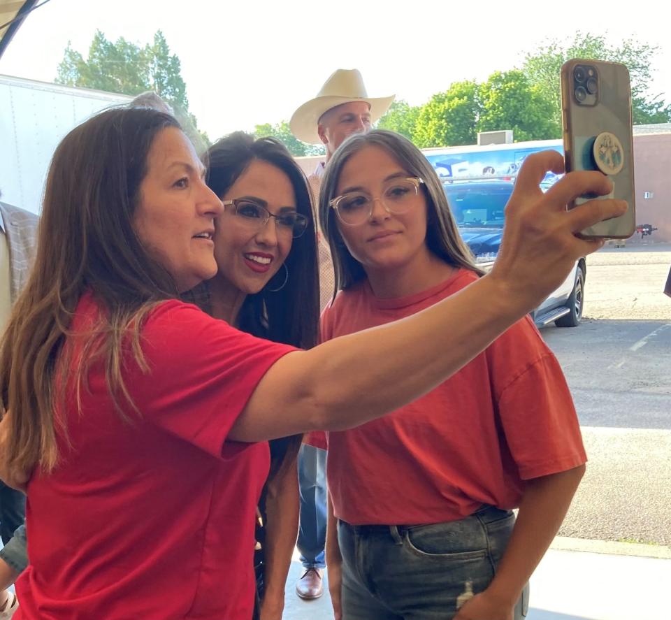 U.S. Rep Lauren Boebert poses for a selfie with Cyndra Shisler (left) and Sophia Bono at Freedom Fest on July 8, 2023.