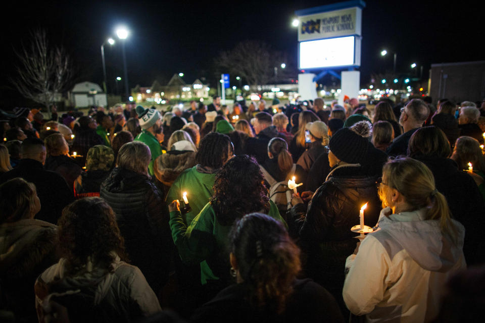 Residents of Newport News hold a candlelight vigil in honor of Richneck Elementary School first-grade teacher Abby Zwerner at the School Administration Building in Newport News, Va., Monday, Jan. 9, 2023. Zwerner was shot and wounded by a 6-year-old student while teaching class on Friday, Jan.6. (AP Photo/John C. Clark)