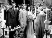 <p>Katharine Hepburn looked incredible as Tracy Lord in her chiffon ruffled wedding gown in <em>The Philadelphia Story. </em>To top off the look, Hepburn wore a wide-brimmed hat, rather than a veil.<br></p>