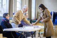 Paris' incumbent mayor Anne Hidalgo casts her ballot for the first round of the French municipal elections, Sunday March 15, 2020 in Paris. The new virus has shuttered all schools, banished cheek-kissing and upended daily life across France, but President Emmanuel Macron won't let it disrupt democracy, so he's maintaining nationwide elections this weekend. (Eliot Blondet/Pool via AP)