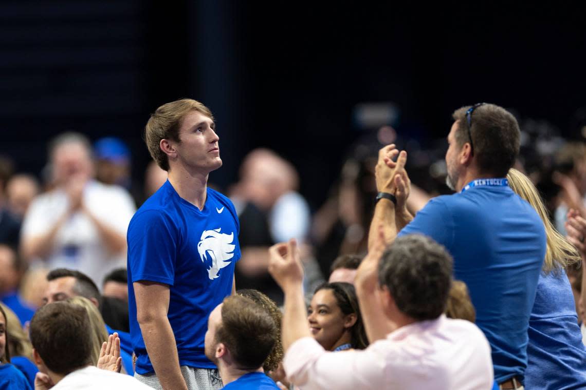 Kentucky Mr. Basketball Travis Perry stands up after Mark Pope singles him out during his opening remarks as UK’s new basketball coach at an event in Rupp Arena on April 14. Perry has since confirmed that he will play for the Wildcats next season.