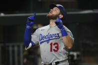 Los Angeles Dodgers first baseman Max Muncy celebrates a home run against the Tampa Bay Rays during the fifth inning in Game 5 of the baseball World Series Sunday, Oct. 25, 2020, in Arlington, Texas. (AP Photo/Eric Gay)