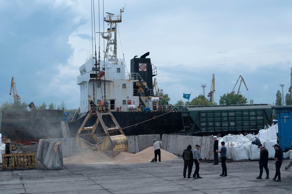 Workers load grain at a grain port in Izmail, Ukraine, Wednesday, April 26 (Copyright 2023 The Associated Press. All rights reserved)