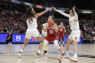 Indiana's Aleksa Gulbe (10) looks to put up a shot against Maryland's Stephanie Jones (24) and Blair Watson (22) during the second half of an NCAA college basketball semifinal game at the Big Ten Conference tournament, Saturday, March 7, 2020, in Indianapolis. Maryland won 66-51. (AP Photo/Darron Cummings)