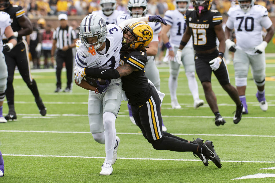 Kansas State wide receiver RJ Garcia II, left, is tackled by Missouri defensive back Kris Abrams-Draine, right, during the first quarter of an NCAA college football game Saturday, Sept. 16, 2023, in Columbia, Mo. (AP Photo/L.G. Patterson)