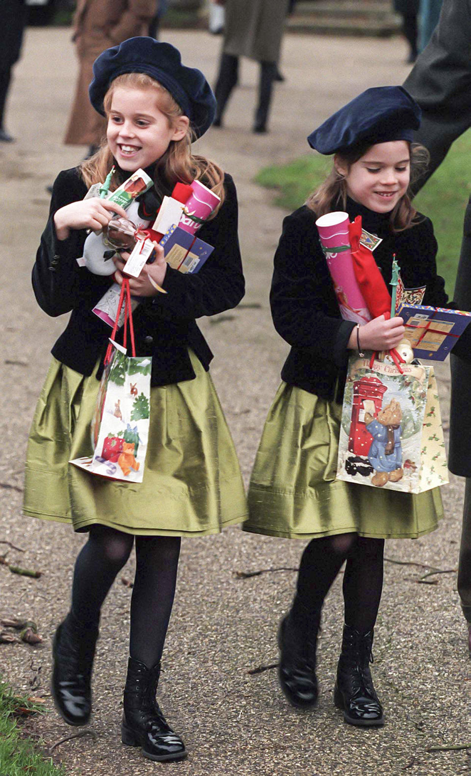 Princess Beatrice and Princess Eugenie couldn’t hold in their excitement in 1997 when they received bundles of gifts from royal fans gathered outside the church. Photo: Getty Images