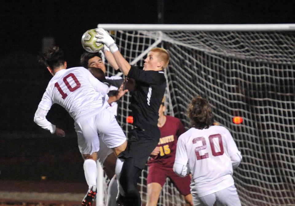 Weymouth goalkeeper Bo Carley leaps to grab a BC High shot during boys soccer Division 1 playoffs at Weymouth High School, Wednesday, Nov. 9, 2022.