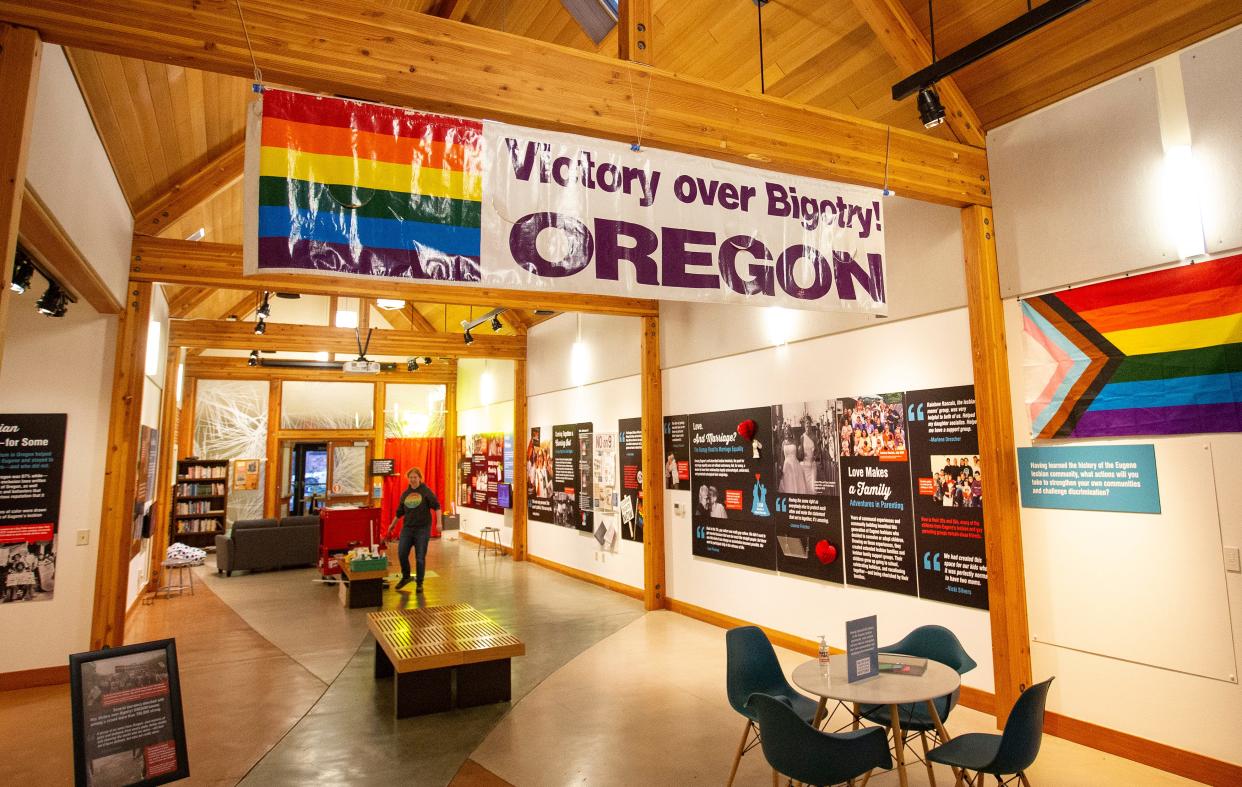 A large banner carried by marchers at the 1993 March on Washington for Lesbian, Gay and Bi-Equal Rights and Liberation greets museum goers as they enter the "Outliers and Outlaws—Stories from the Eugene Lesbian History Project” exhibit at the Museum of Natural and Cultural History in Eugene. 