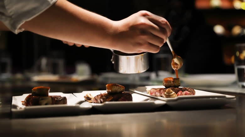 Chef preparing steak dishes 