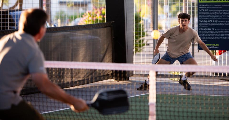 People play pickleball during the soft opening in August of Chicken N Pickle in Glendale, Arizona.