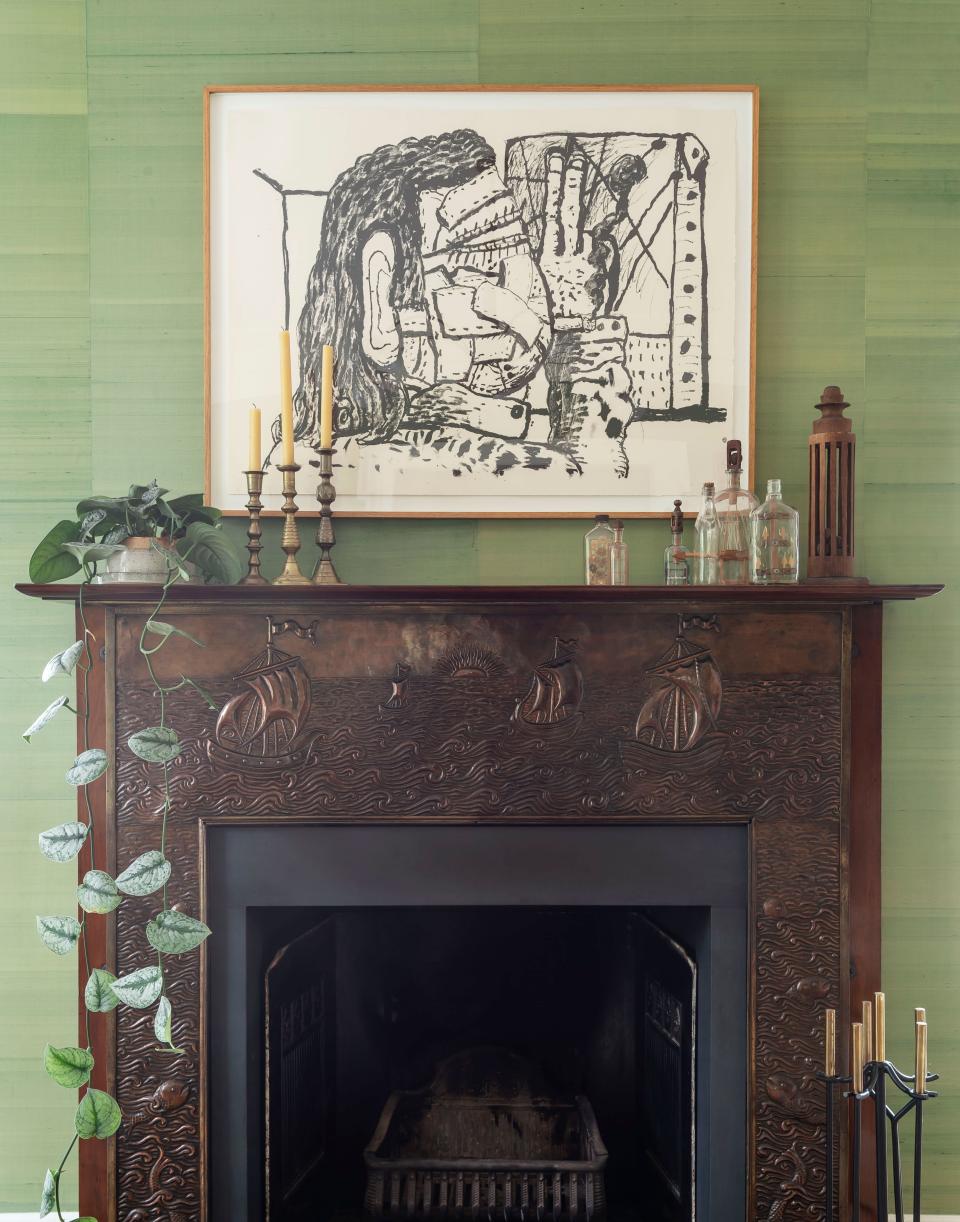 Green tones help cast this fireplace into greater focus.