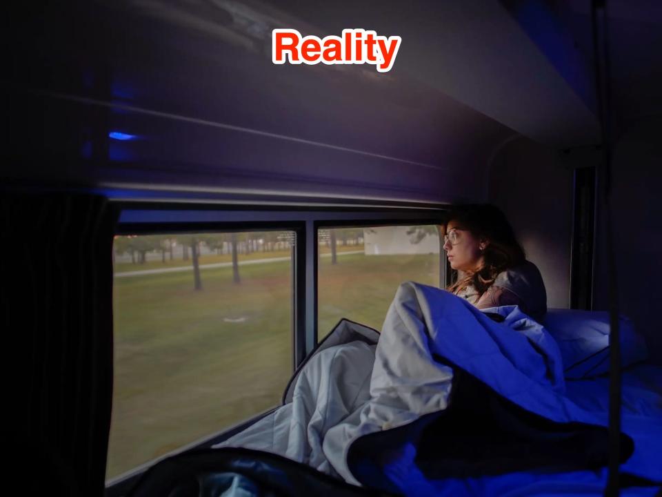 The author lays in the train bed looking out the window on the left side