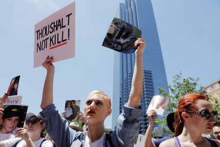 Gun control demonstrators protest outside of the annual National Rifle Association (NRA) convention in Dallas, Texas, U.S., May 5, 2018. REUTERS/Lucas Jackson