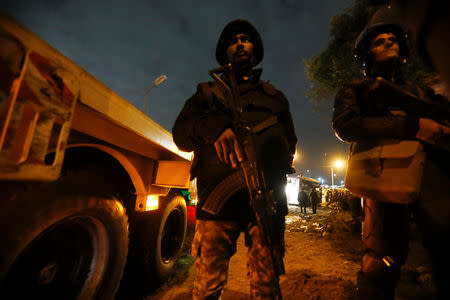 Riot police secure a scene of a bus blast in Giza, Egypt, December 28, 2018. REUTERS/Amr Abdallah Dalsh