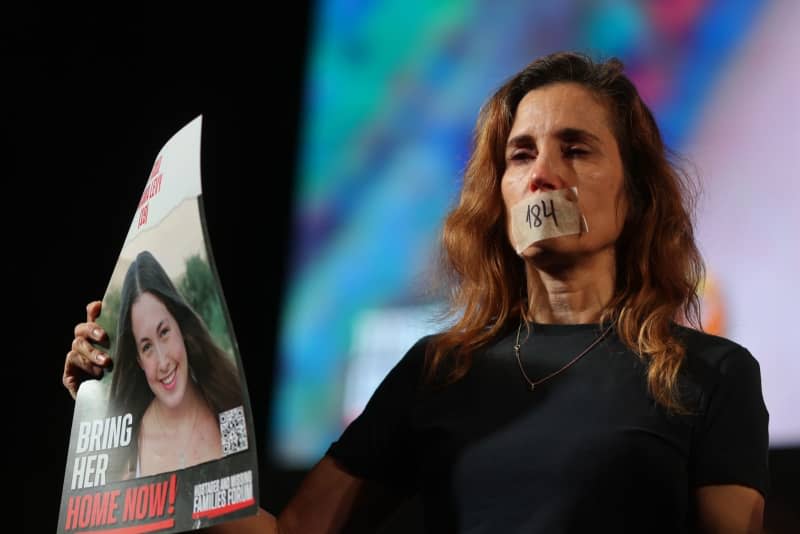 An Israeli woman takes part in a rally marking six months since the Israeli-Hamas war and calling for the release of hostages held by Hamas. Ilia Yefimovich/dpa