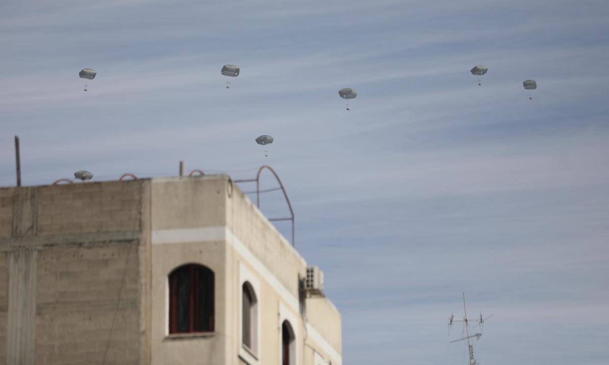 <span>Aid packages dropped over Gaza City by the Jordanian air force on Friday.</span><span>Photograph: Anadolu/Getty Images</span>