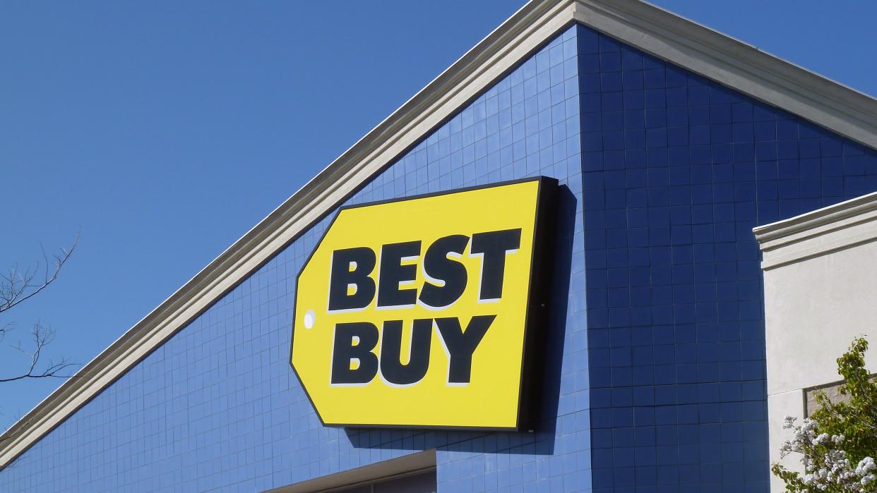  An image of a Best Buy store, with the Best Buy logo prominently featured. 