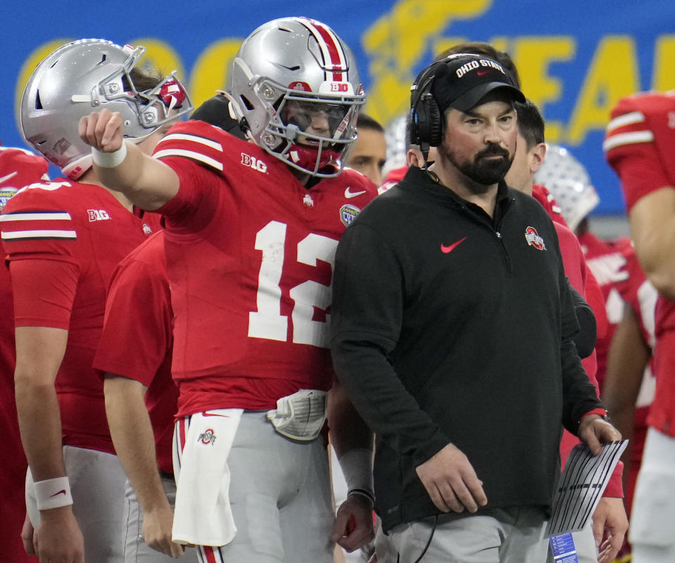 Dec 29, 2023; Arlington, TX, USA; Ohio State Buckeyes quarterback Lincoln Kienholz (12) talks to Ohio State Buckeyes head coach Ryan Day in the third quarter against <a class="link " href="https://sports.yahoo.com/ncaaf/teams/missouri/" data-i13n="sec:content-canvas;subsec:anchor_text;elm:context_link" data-ylk="slk:Missouri Tigers;sec:content-canvas;subsec:anchor_text;elm:context_link;itc:0">Missouri Tigers</a> during the Goodyear Cotton Bowl Classic at AT&T Stadium. Mandatory Credit: Kyle Robertson-USA TODAY Sports