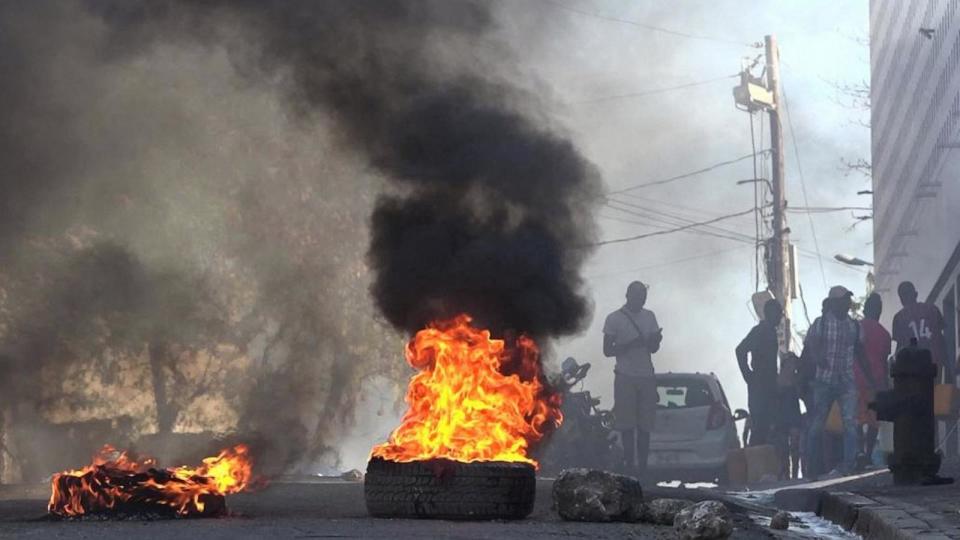 PHOTO: This screen grab taken from AFPTV shows tires on fire near the National Penitentiary in Port-au-Prince, Haiti, on March 3, 2024, after armed gangs attacked the country's largest prison and freed scores of inmates. (Luckenson Jean/AFPTV/AFP via Getty Images)