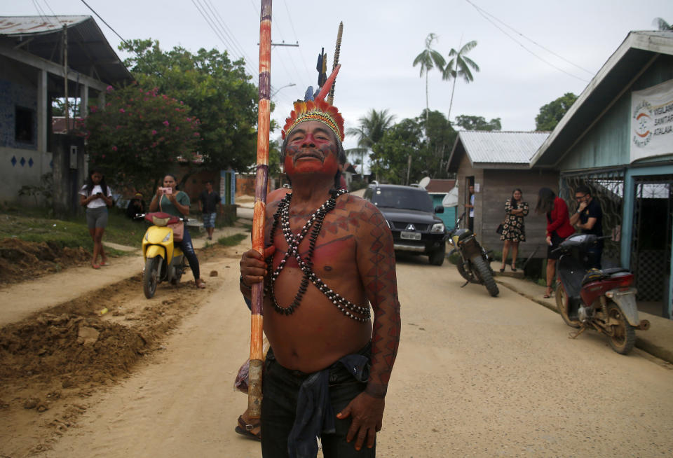 Kanamri Indigenous man Eduardo Kanamari marches to protest against the disappearance of Indigenous expert Bruno Pereira and freelance British journalist Dom Phillips, in Atalaia do Norte, Vale do Javari, Amazonas state, Brazil, Monday, June 13, 2022. Brazilian police are still searching for Pereira and Phillips, who went missing in a remote area of Brazil's Amazon a week ago. (AP Photo/Edmar Barros)