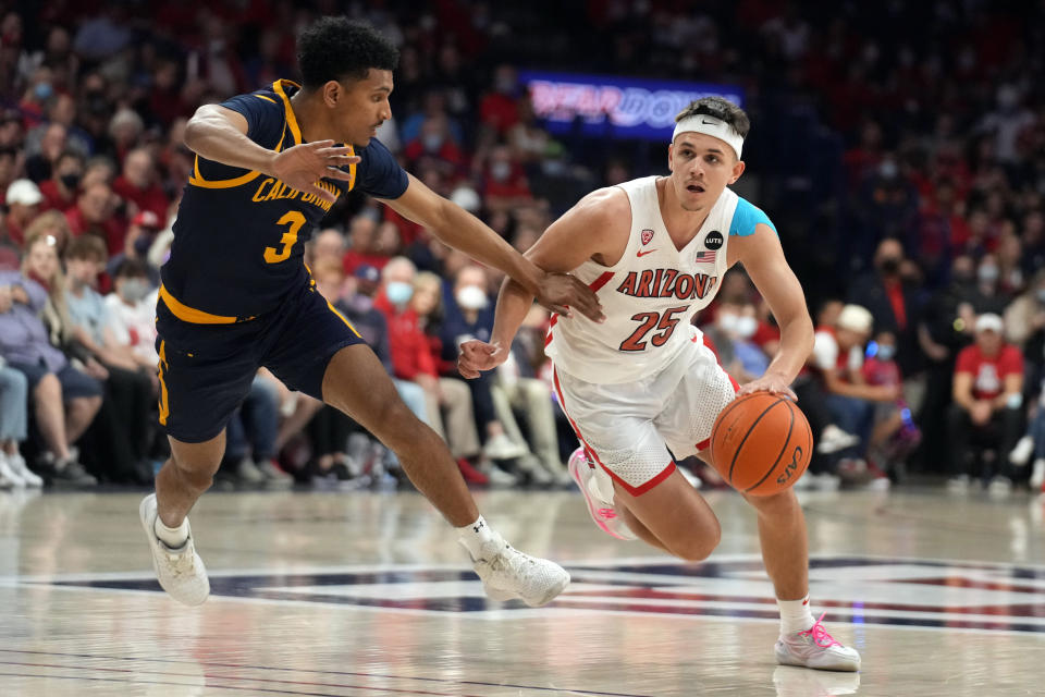 Arizona guard Kerr Kriisa (25) drives on California guard Jarred Hyder during the second half of an NCAA college basketball game, Saturday, March 5, 2022, in Tucson, Ariz. (AP Photo/Rick Scuteri)