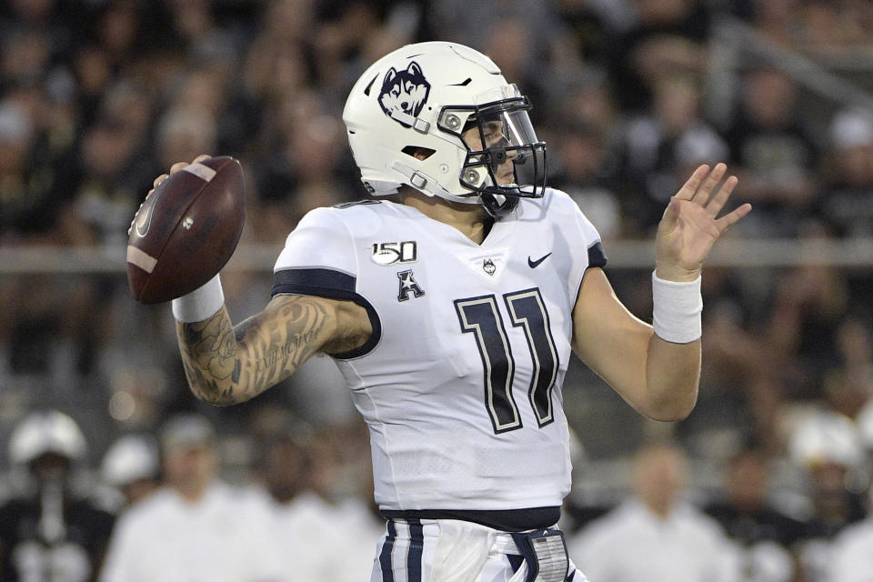 Connecticut quarterback Jack Zergiotis (11) throws a pass during the first half of an NCAA college football game against Central Florida, Saturday, Sept. 28, 2019, in Orlando, Fla. (AP Photo/Phelan M. Ebenhack)