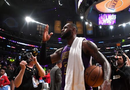 Nov 14, 2018; Los Angeles, CA, USA; Los Angeles Lakers forward LeBron James (23) walks off the court with the game ball after the game against the Portland Trail Blazers at Staples Center. The Lakers defeated the Trail Blazers 126-117. James scored 44 points to surpass Wilt Chamberlain to move into fifth on the all-time career NBA scoring list. Mandatory Credit: Kirby Lee-USA TODAY Sports
