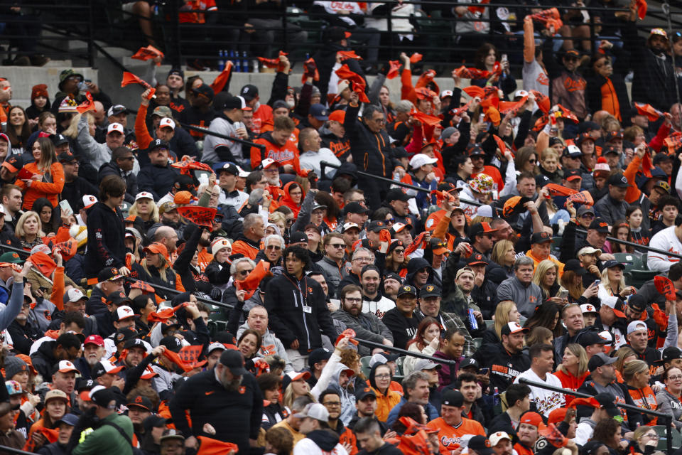 Baltimore Orioles fans cheer on the team during the first inning of a baseball game against the Los Angeles Angels, Thursday, March 28, 2024, in Baltimore. (AP Photo/Julia Nikhinson)
