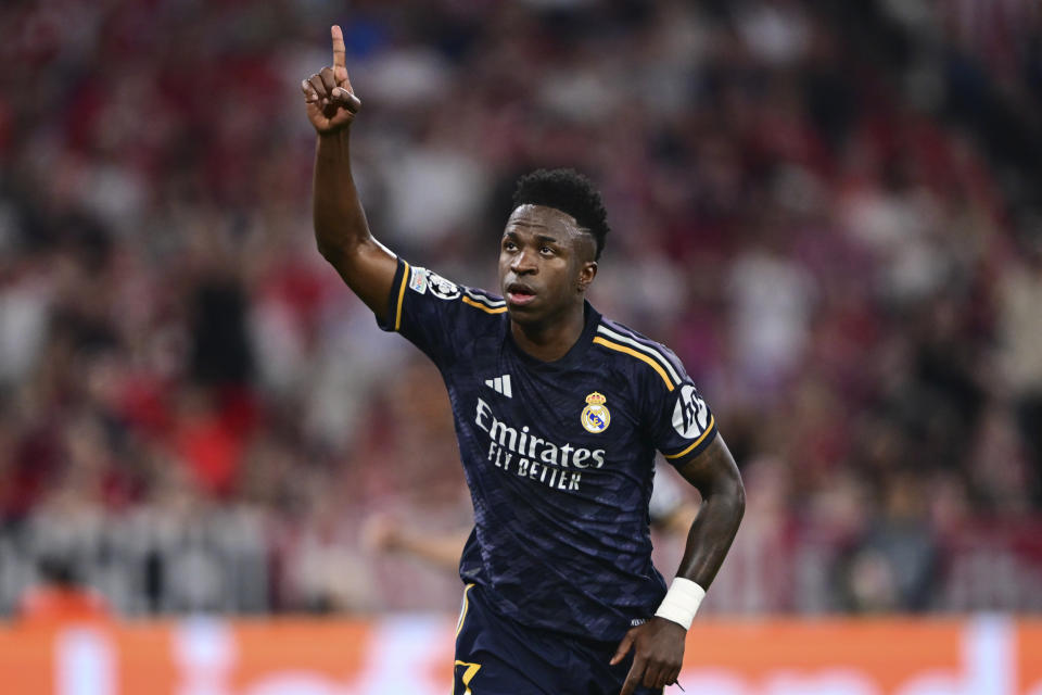 Real Madrid's Vinicius Junior celebrates after scoring his side's second goal on a penalty kick during the Champions League semifinal first leg soccer match between Bayern Munich and Real Madrid at the Allianz Arena in Munich, Germany, Tuesday, April 30, 2024. (AP Photo/Christian Bruna)