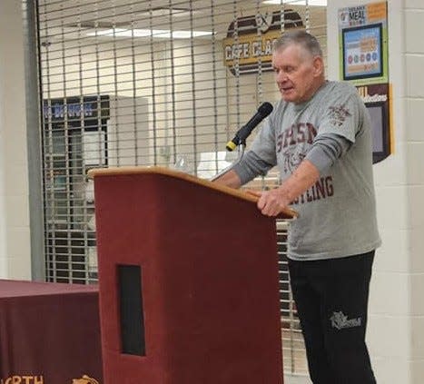Former Bloomington North head wrestling coach Bo Henry gives his acceptance speech after being inducted to the Cougar Legacy Club, a hall of fame for former Cougar wrestlers, coaches and supporters.