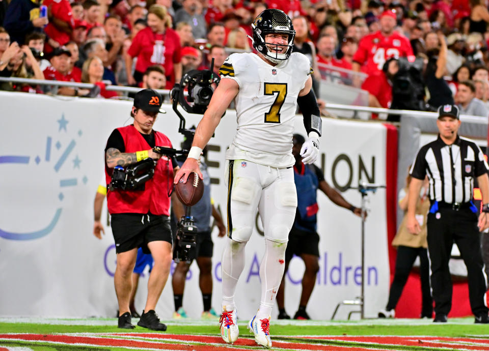 TAMPA, FLORIDA - DECEMBER 05: Taysom Hill #7 of the New Orleans Saints celebrates after scoring a touchdown against the Tampa Bay Buccaneers during the second quarter in the game at Raymond James Stadium on December 05, 2022 in Tampa, Florida. (Photo by Julio Aguilar/Getty Images)