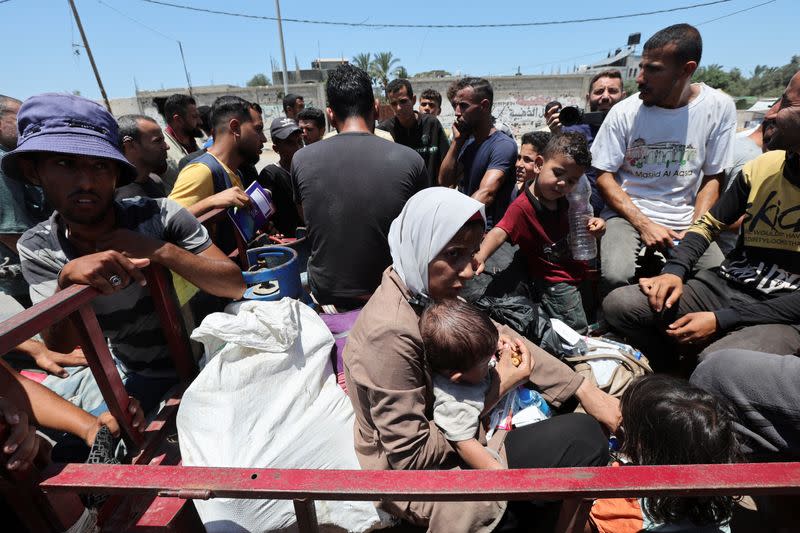 Displaced Palestinians, who fled north Gaza after they were ordered by Israeli army to move southward, amid Israel-Hamas conflict, arrive in Nuseirat in the central Gaza Strip