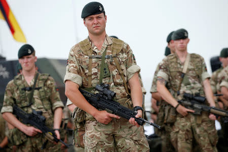 British servicemen stand at attention during an opening ceremony of the NATO-led military exercises "Noble Partner 2018" at Vaziani military base outside Tbilisi, Georgia, August 1, 2018. REUTERS/David Mdzinarishvili