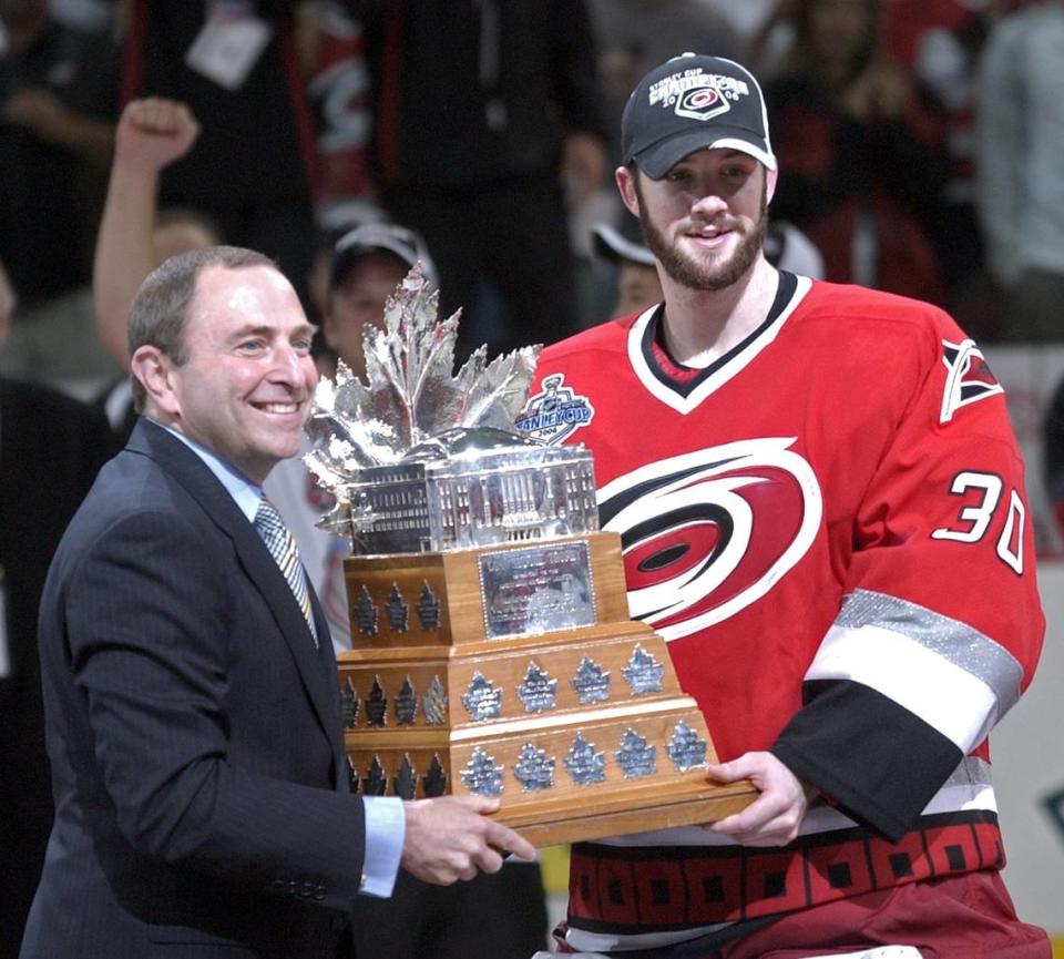 NHL Commissioner Gary Bettman, left, presents Carolina Hurricanes goalie Cam Ward with the Conn Smythe Trophy as playoff MVP in 2006.