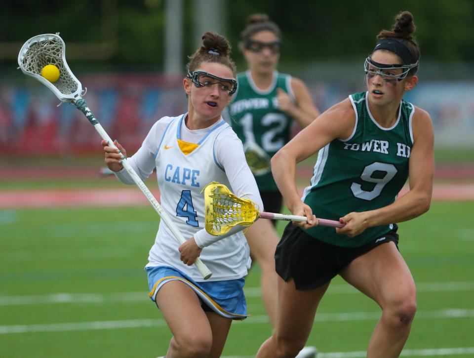 Cape Henlopen's Elizabeth Rishko (4) advances the ball as Tower Hill's Lucy Nace pursues in the second half of Cape Henlopen's 21-11 win in a DIAA high school state tournament semifinal at Delaware State University's Alumni Stadium, Tuesday May 24, 2022.