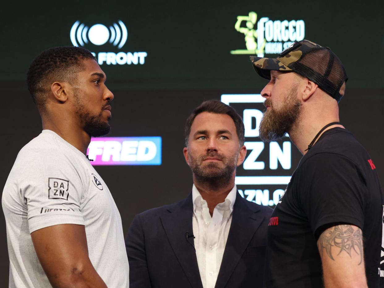 Anthony Joshua, left, and Robert Helenius face off at their pre-fight press conference (Getty Images)