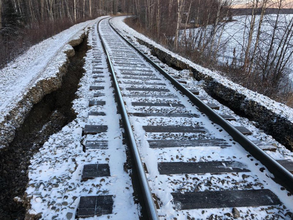 This Friday, Nov. 30, 2018 photo provided by Alaska Railroad Corp. shows damage from a magnitude 7.0 earthquake by Nancy Lake, near Willow, Alaska. The railroad will use heavy equipment to repair the damage before it can resume train traffic between Anchorage and Fairbanks, Alaska's two largest cities. (Lloyd Tesch/Alaska Railroad Corp. via AP)