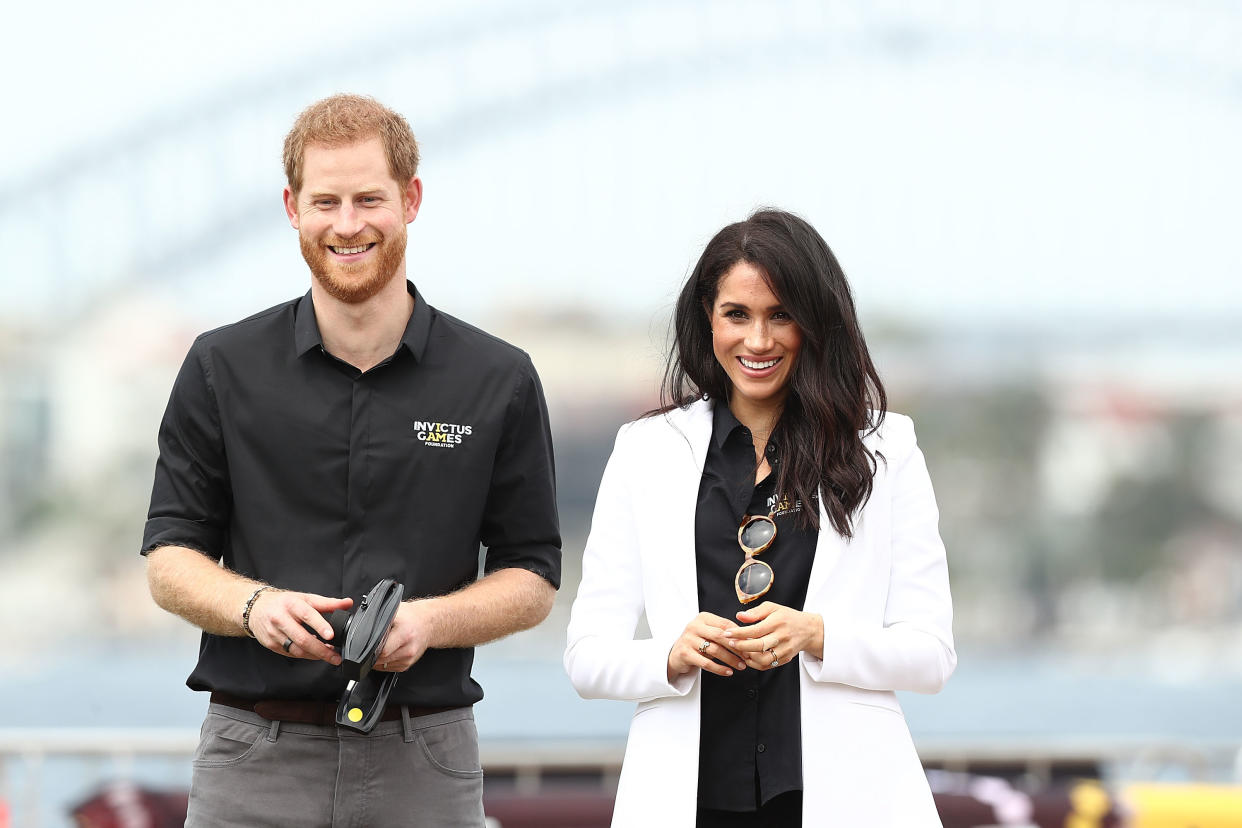 SYDNEY, AUSTRALIA - OCTOBER 20:  Prince Harry, Duke of Sussex and Meghan, Duchess of Sussex watch children control remote control cars during the JLR Drive Day at Cockatoo Island on October 20, 2018 in Sydney, Australia.  (Photo by Mark Metcalfe/Getty Images for the Invictus Games Foundation)