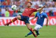 Spanish midfielder Xabi Alonso (L) vies with Italian forward Antonio Di Natale during the Euro 2012 championships football match Spain vs Italy on June 10, 2012 at the Gdansk Arena. AFPPHOTO/ GIUSEPPE CACACEGIUSEPPE CACACE/AFP/GettyImages