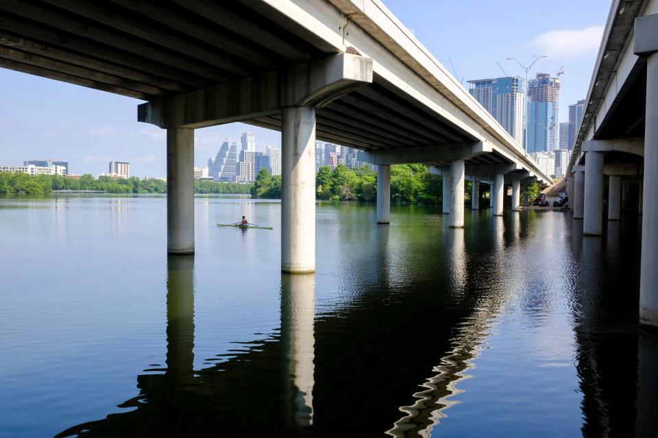 A rower rests beneath the I-35 bridge over Lady Bird Lake, part of the beautiful view from the Butler Trail, earlier this month.