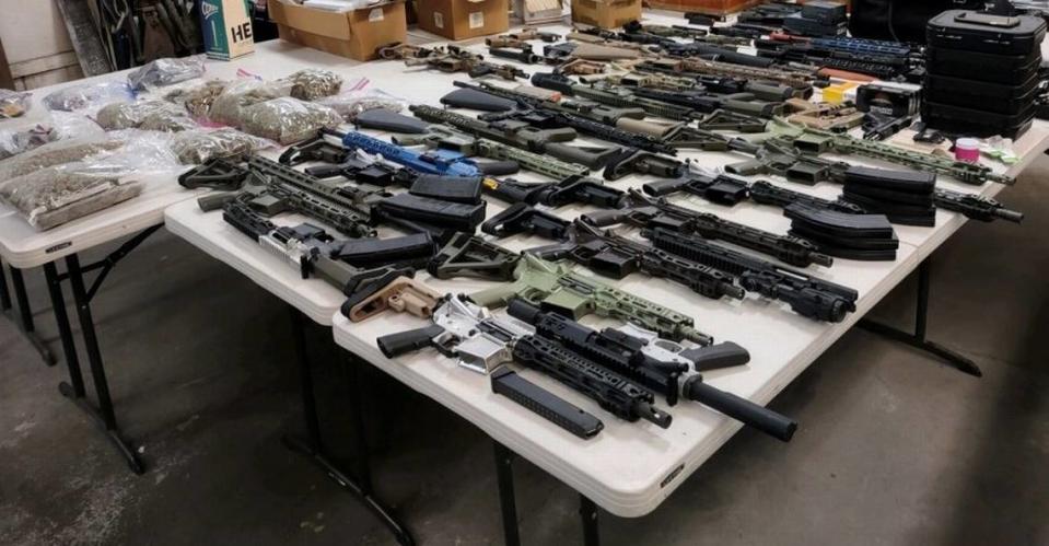 A 24-year-old Edgewood man was recently arrested in northeast Nevada after being stopped for speeding on a highway, allegedly in possession of dozens of assault-style weapons, pounds of marijuana and about $12,500 cash.