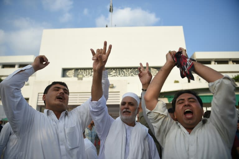 Supporters of Imran Khan celebrated outside parliament after lawmakers confirmed the World Cup cricket hero would become Pakistan's next prime minister