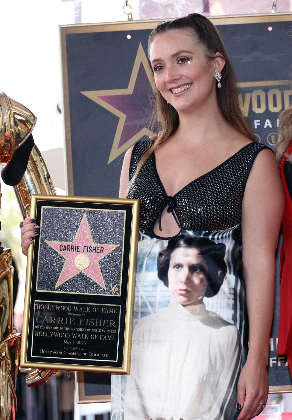 Billie Lourd poses with Carrie Fisher's Hollywood Walk of Fame star.