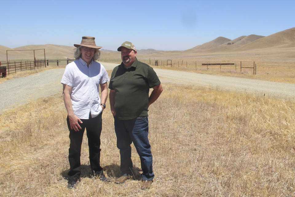 Jerry Brown, left, and Kevin Spesert stand at what would be the bottom of the Sites Reservoir in Sites, Calif., on Friday, July 23, 2021. Brown is the executive director of the Sites Project Authority and Spesert is the authority's public affairs and real estate manager. The project would be used to store water during wet years for use during droughts. The reservoir would be large enough to supply water for 1.5 million households each for one year. (AP Photo/Adam Beam)