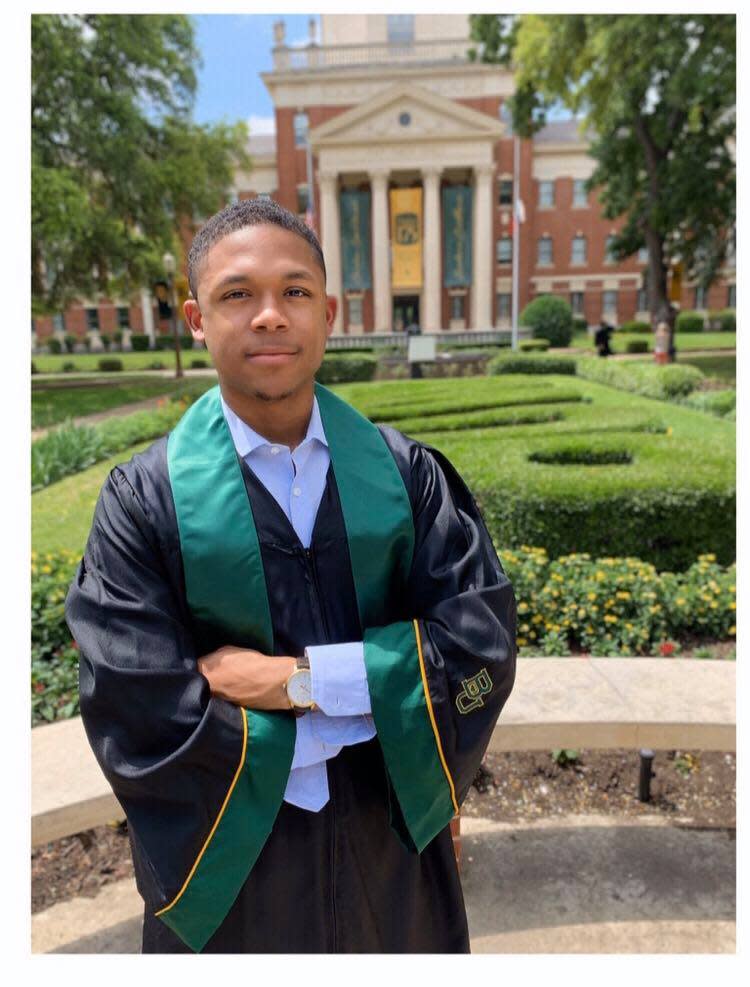 Williams poses in his cap and gown in front of Baylor University. (Photo: Courtesy of Ayanna Tatum)