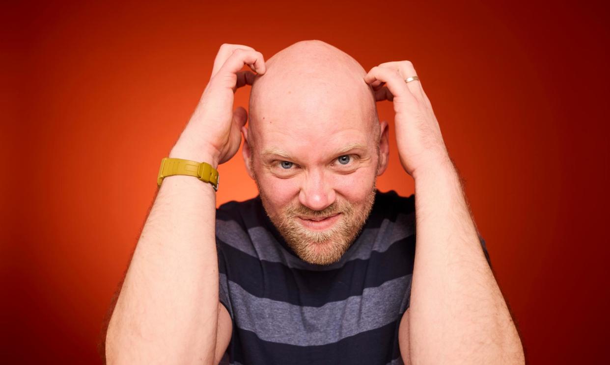 <span>‘I can now walk through rainstorms without worrying what it will do to my hair’ … Stuart Heritage.</span><span>Photograph: David Levene/The Guardian</span>