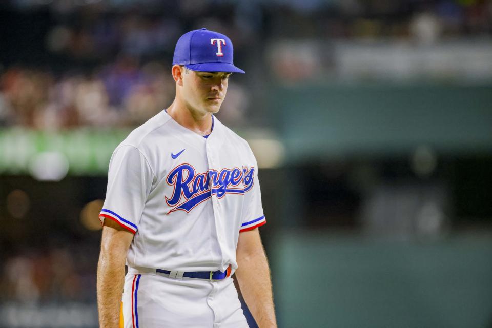 Texas Rangers pitcher Cody Bradford walks to the dugout after the second inning of a baseball game against the Atlanta Braves in Arlington, Texas, Monday, May 15, 2023. (AP Photo/Gareth Patterson)