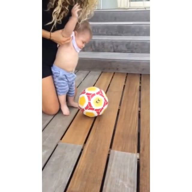 Here's hoping Shakira's son, Sasha, follows in his father's athletic footsteps! On Wednesday, Shakira shared this adorable video of her youngest son Sasha with her boyfriend, pro soccer player Gerard Pique, taking what appears to be his first kick at a soccer ball. "Happy 6 months Sasha! Shak," the Columbian superstar wrote on Instagram. <strong>WATCH: How Shakira Met Her Baby Daddy</strong> Shakira, 38, and Gerard, 28, welcomed baby Sasha in January. The attractive couple are also parents to their 2-year-old son, Milan. In April, the "Can't Remember to Forget You" shared her parenting philosophy with <em>Parents Latina</em>. "In Spain, parents speak to their children as equals, and I feel that the children respond in turn," she said. "Their dad and I both grew up in very close-knit families, and that has made us openly affectionate parents." With babies as cute and healthy-looking as Sasha and Milan, the parents are obviously doing something right. <strong>WATCH: Shakira and Gerard Pique Welcome Baby Sasha!</strong> Watch the ridiculously cute video below to see Shakira teaching Milan how to read!