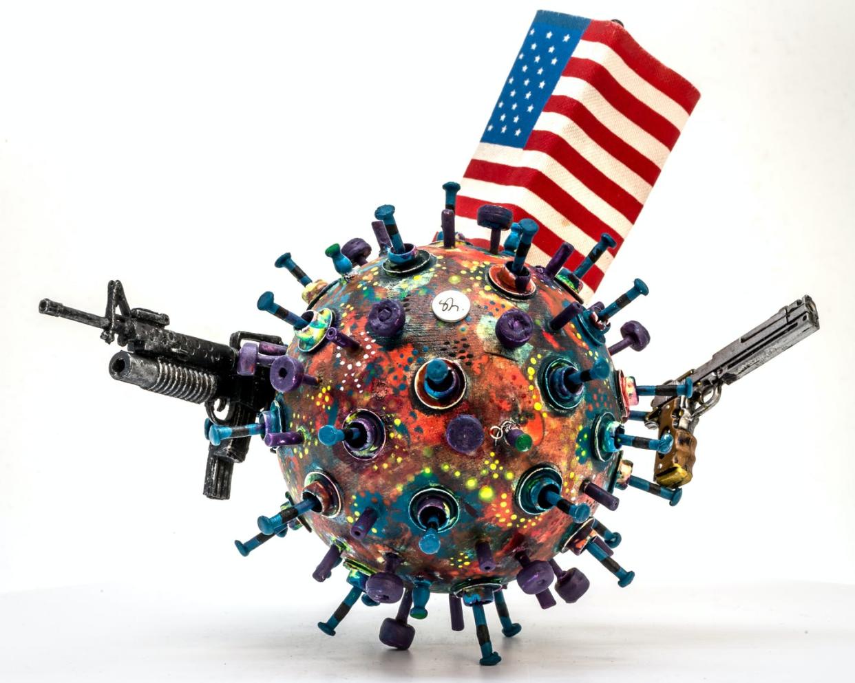 <span class="caption">Big, tough and strong is only helpful when you're fighting other people.</span> <span class="attribution"><a class="link " href="https://www.gettyimages.com/detail/photo/close-up-of-coronavirus-model-with-guns-and-flag-on-royalty-free-image/1220591463?adppopup=true" rel="nofollow noopener" target="_blank" data-ylk="slk:Sergi Rodriguez Lopez/EyeEm via Getty Images;elm:context_link;itc:0;sec:content-canvas">Sergi Rodriguez Lopez/EyeEm via Getty Images</a></span>