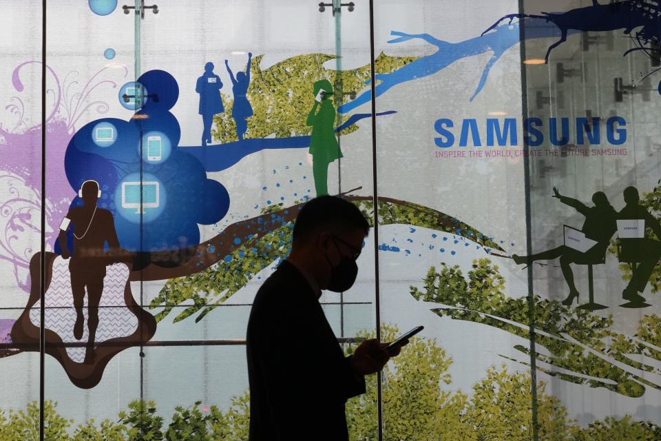 A man walks by Samsung Electronics' shop in Seoul, South Korea, Tuesday, April 30, 2024. Samsung Electronics on Tuesday reported a 10-fold increase in operating profit for the last quarter as the expansion of artificial intelligence technologies drives a rebound in the markets for computer memory chips.(AP Photo/Ahn Young-joon)